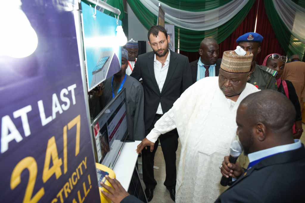 pix shows: Deputy Governor of Kastina State, Alhaji Munir Yakubu inspecting the MTN Mobile electricity device during the Kastina State Economic and Investment Summit