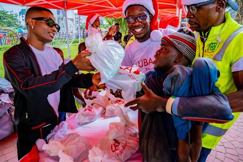 Uzoka, Wizkid Give Back To Thousands At The UBA Foundation Food Bank-marketingspace.com.ng